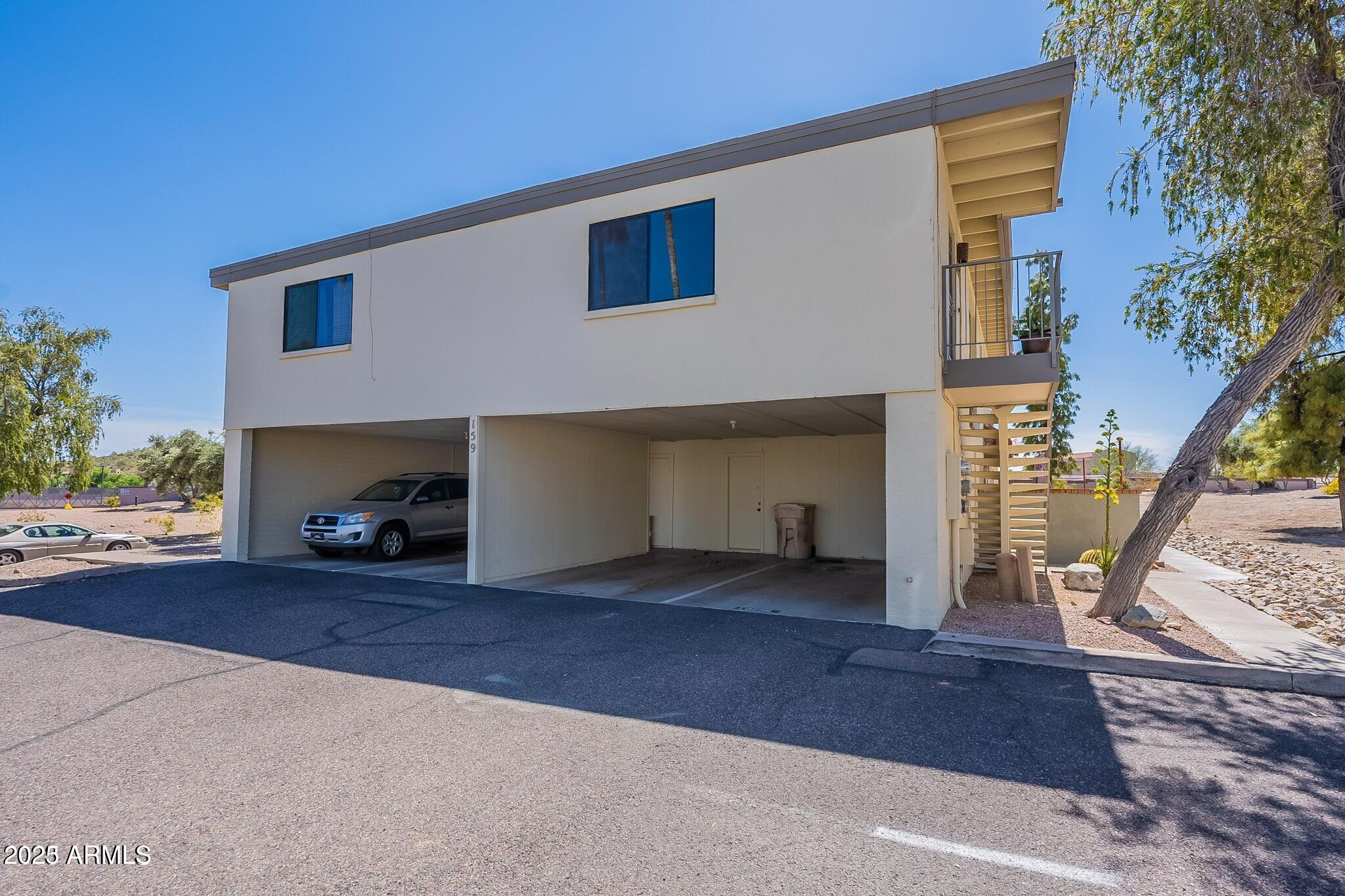 14234 North Oakwood Lane, Unit C Fountain Hills, AZ 85268 - Photo 17 of 22 a view of a house with a street