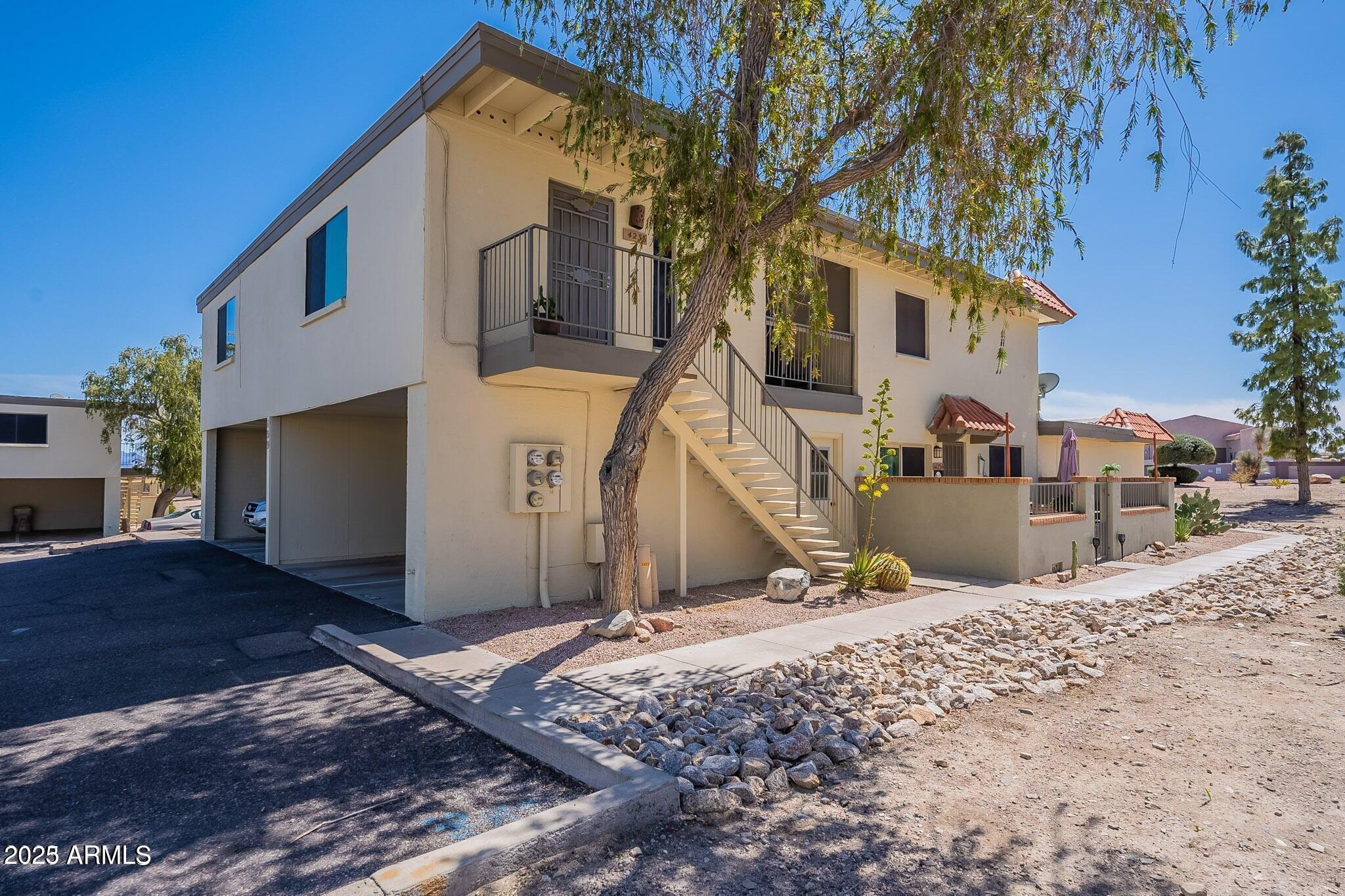 14234 North Oakwood Lane, Unit C Fountain Hills, AZ 85268 - Photo 18 of 22 a view of a house with a snow in the yard