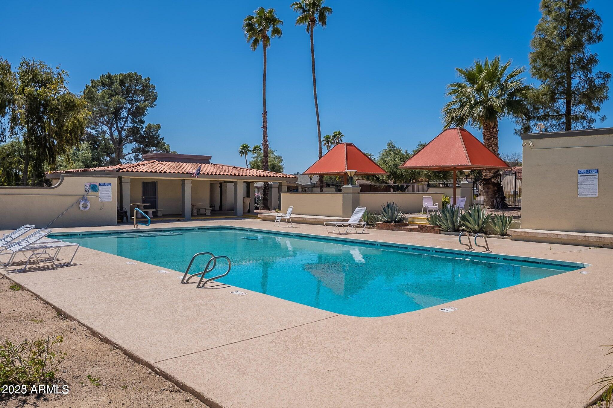 14234 North Oakwood Lane, Unit C Fountain Hills, AZ 85268 - Photo 20 of 22 a view of house with outdoor space and swimming pool