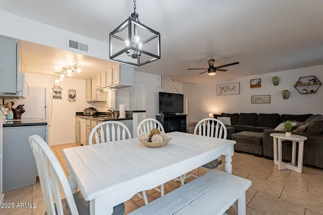 a very nice looking dining room with a table and chairs