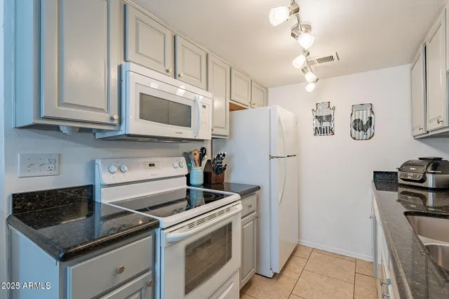a kitchen with a stove and a microwave