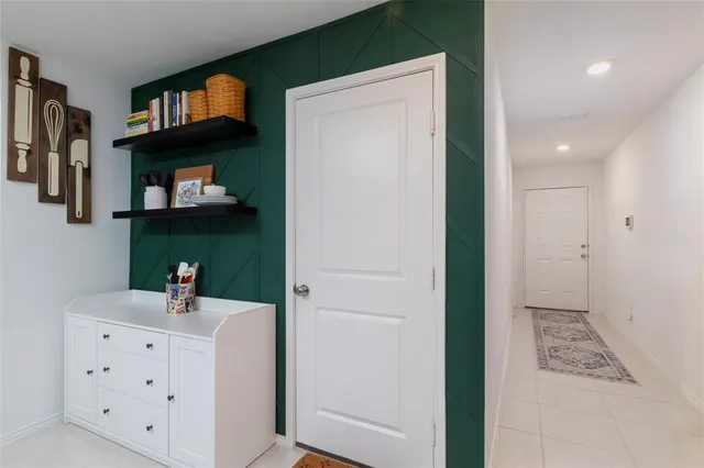 a kitchen with cabinets and a wooden floor