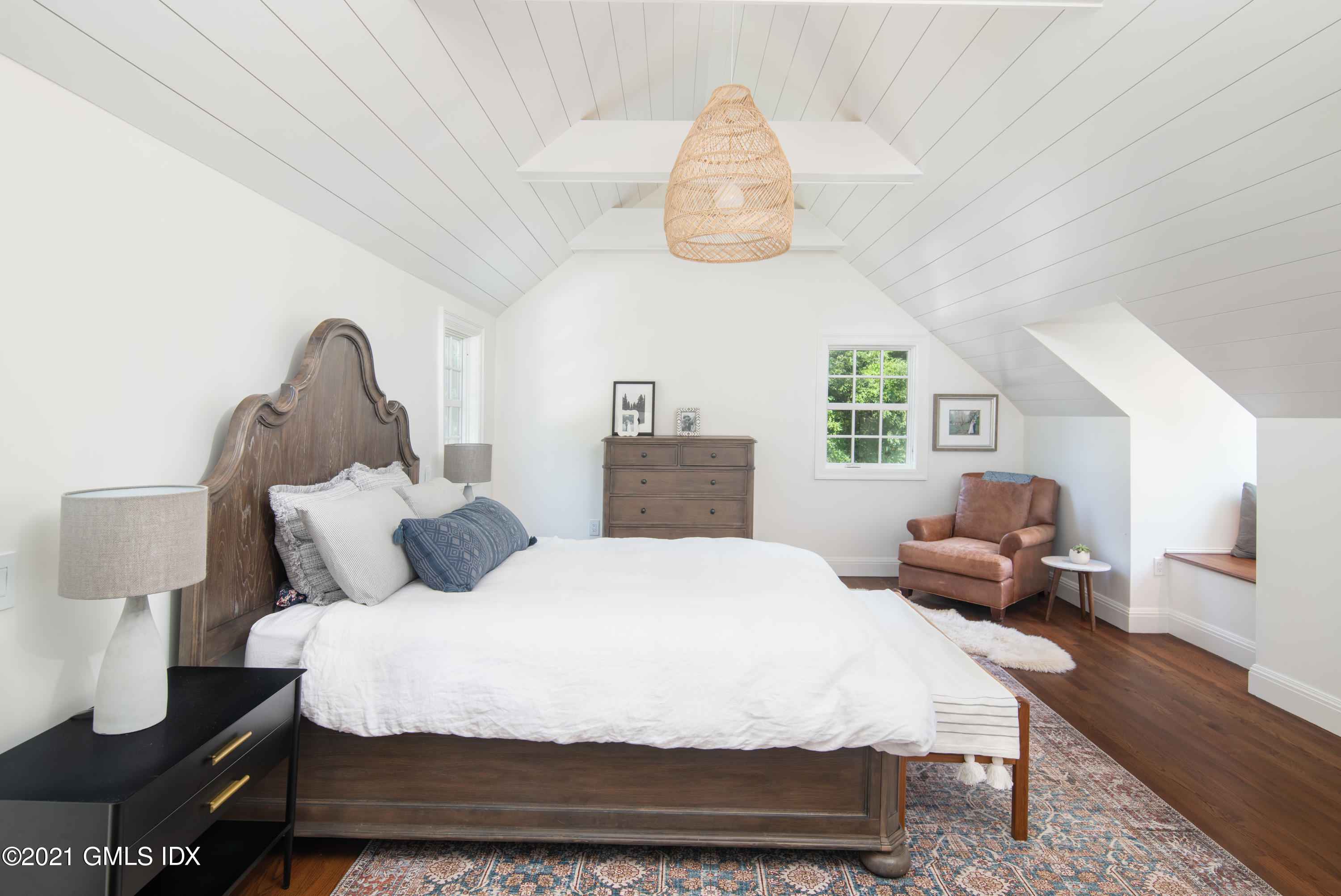 10 Pine Ridge Road Greenwich, CT 06830 - Photo 12 of 17 a bedroom with a bed and wooden floor