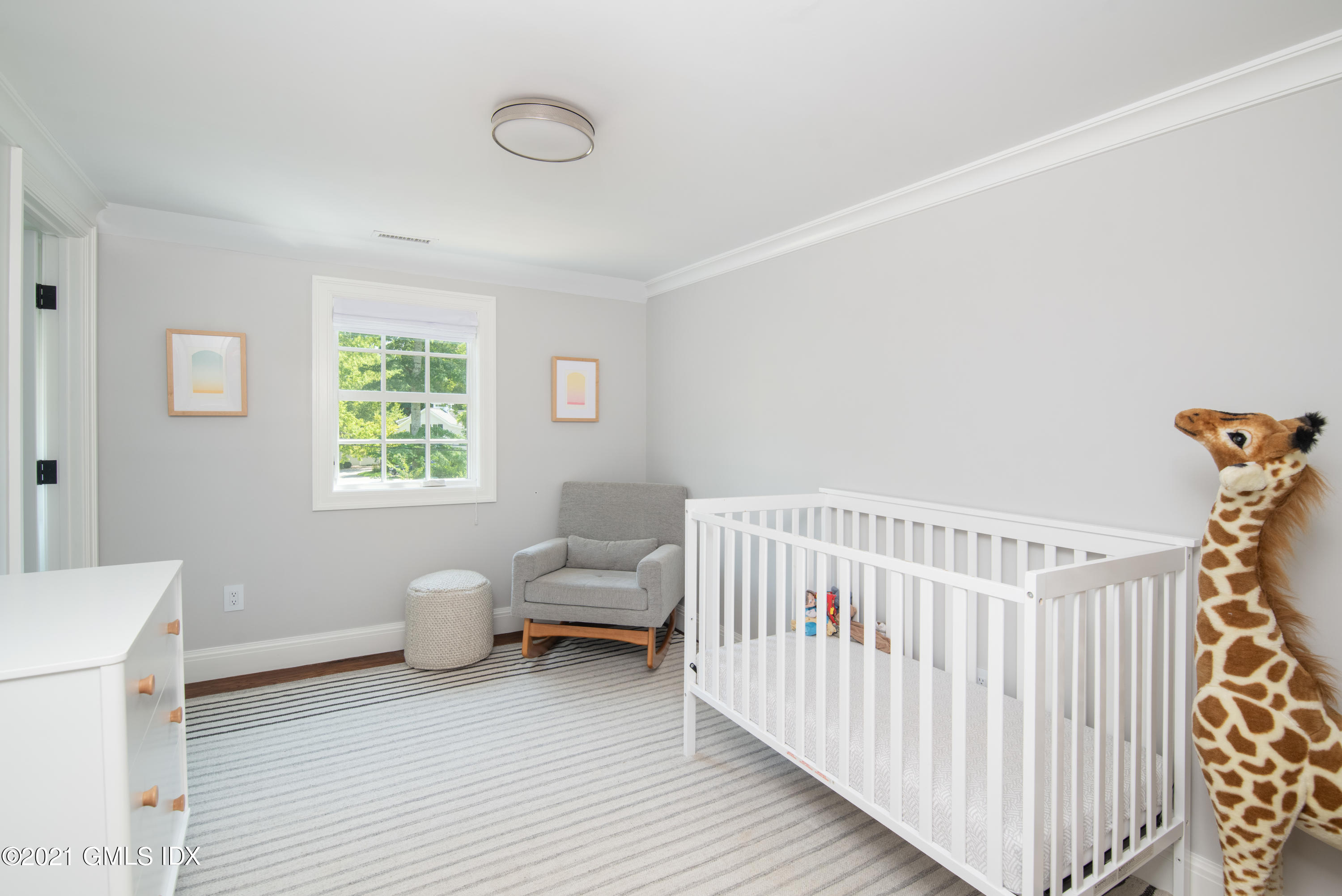 10 Pine Ridge Road Greenwich, CT 06830 - Photo 13 of 17 a bedroom with furniture and a window