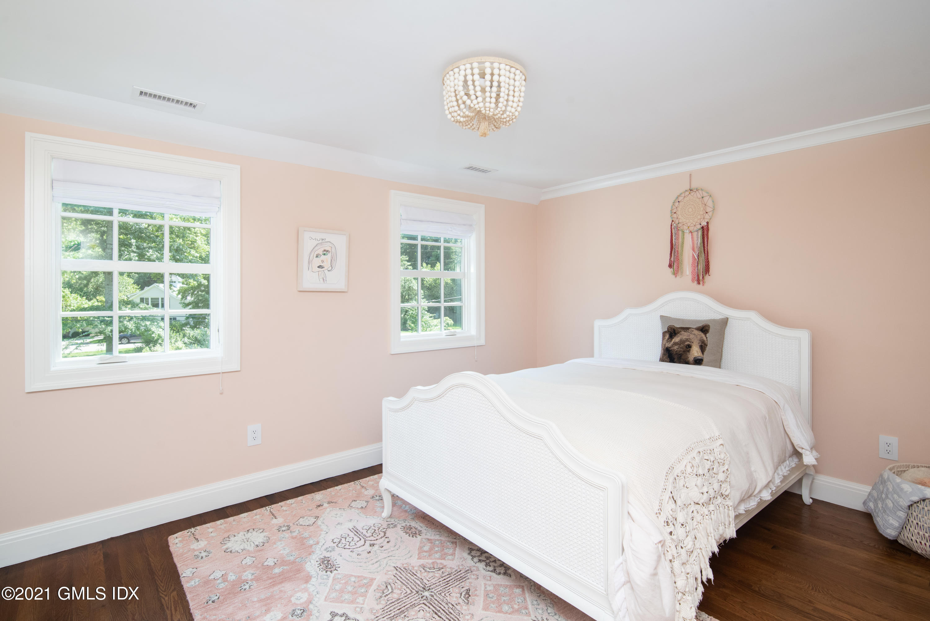10 Pine Ridge Road Greenwich, CT 06830 - Photo 14 of 17 a bedroom with a bed and a window