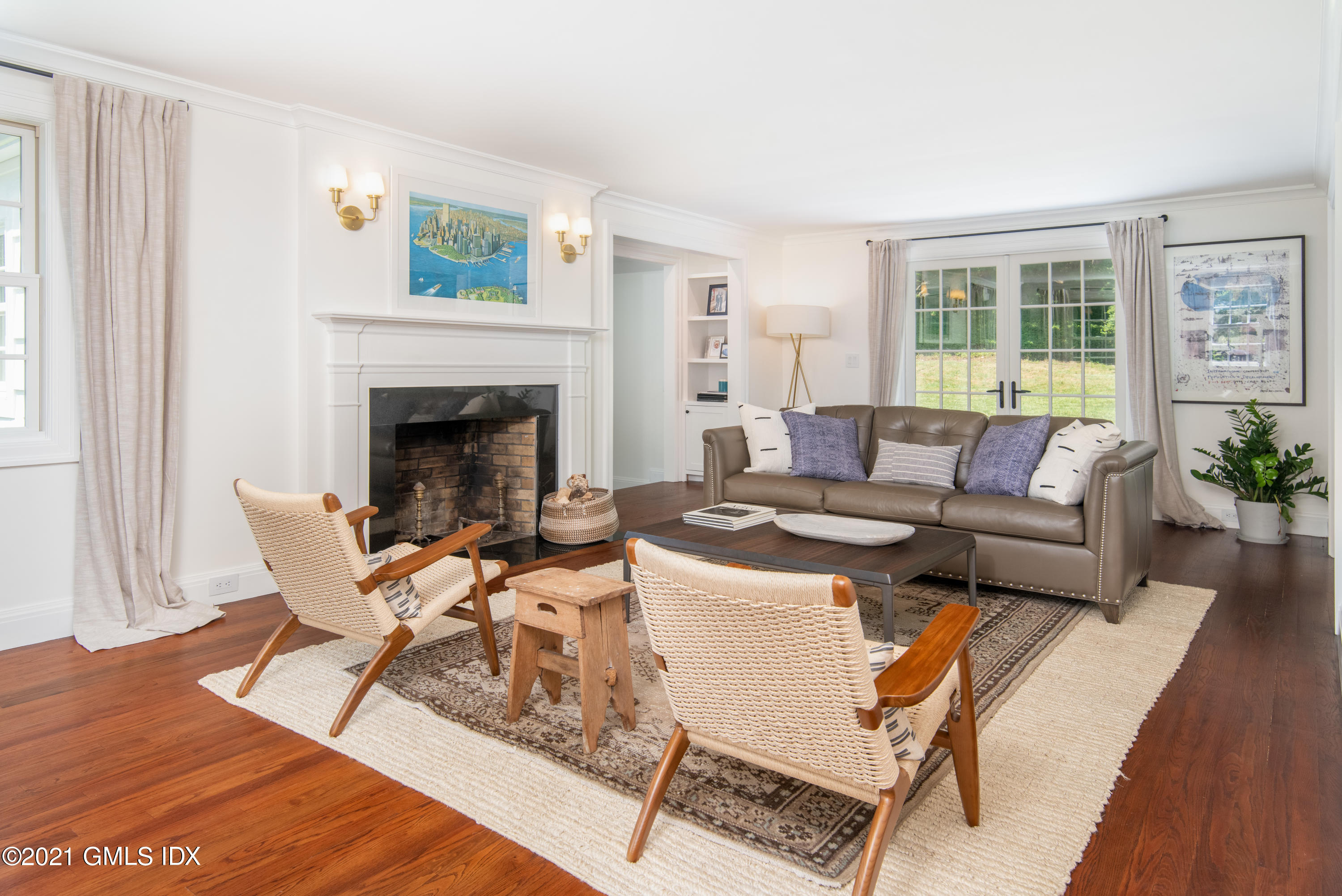 10 Pine Ridge Road Greenwich, CT 06830 - Photo 2 of 17 a living room with a couch and a fireplace