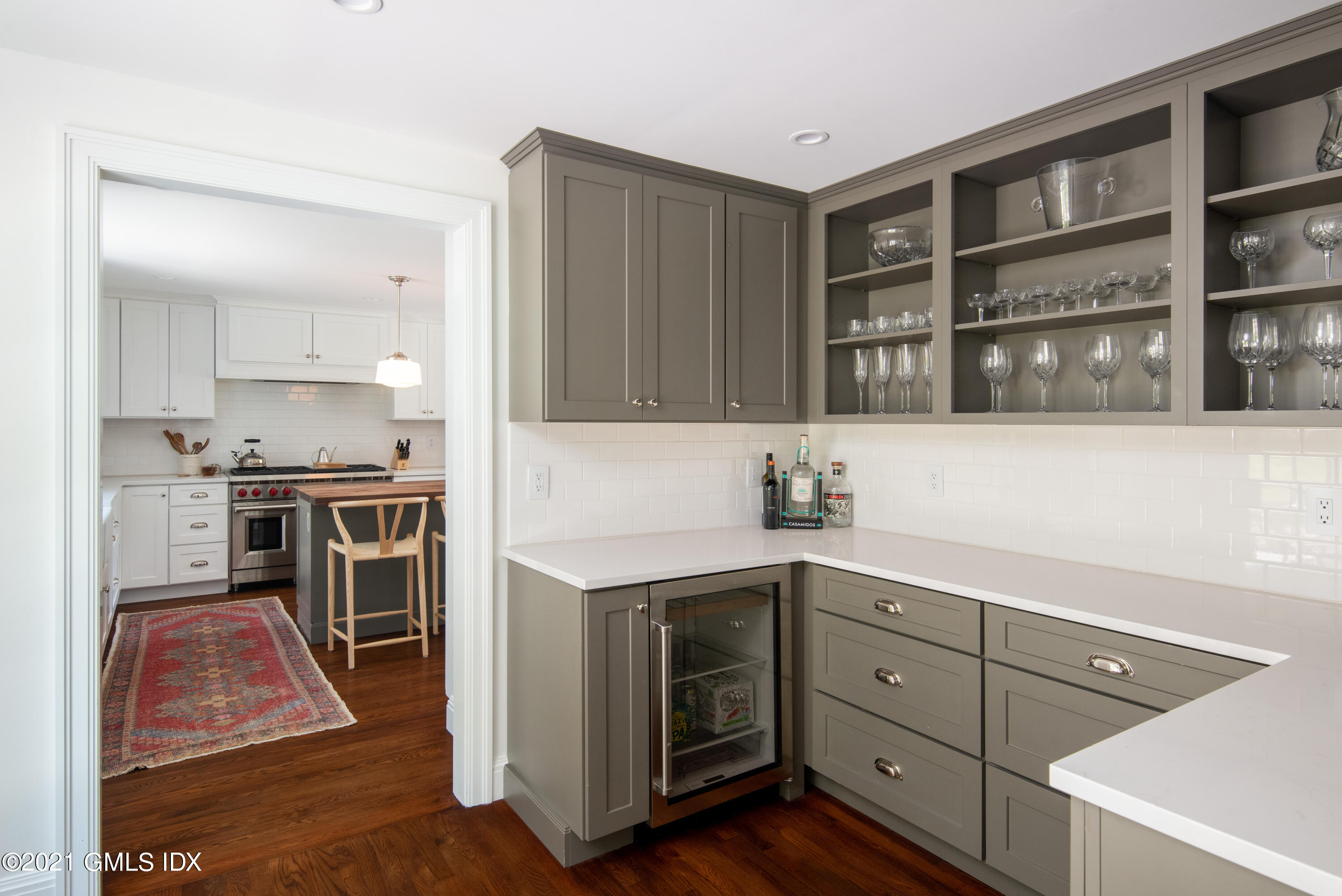 10 Pine Ridge Road Greenwich, CT 06830 - Photo 6 of 17 a kitchen with a refrigerator and a stove top oven