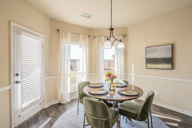 a view of a dining room with furniture window and outside view