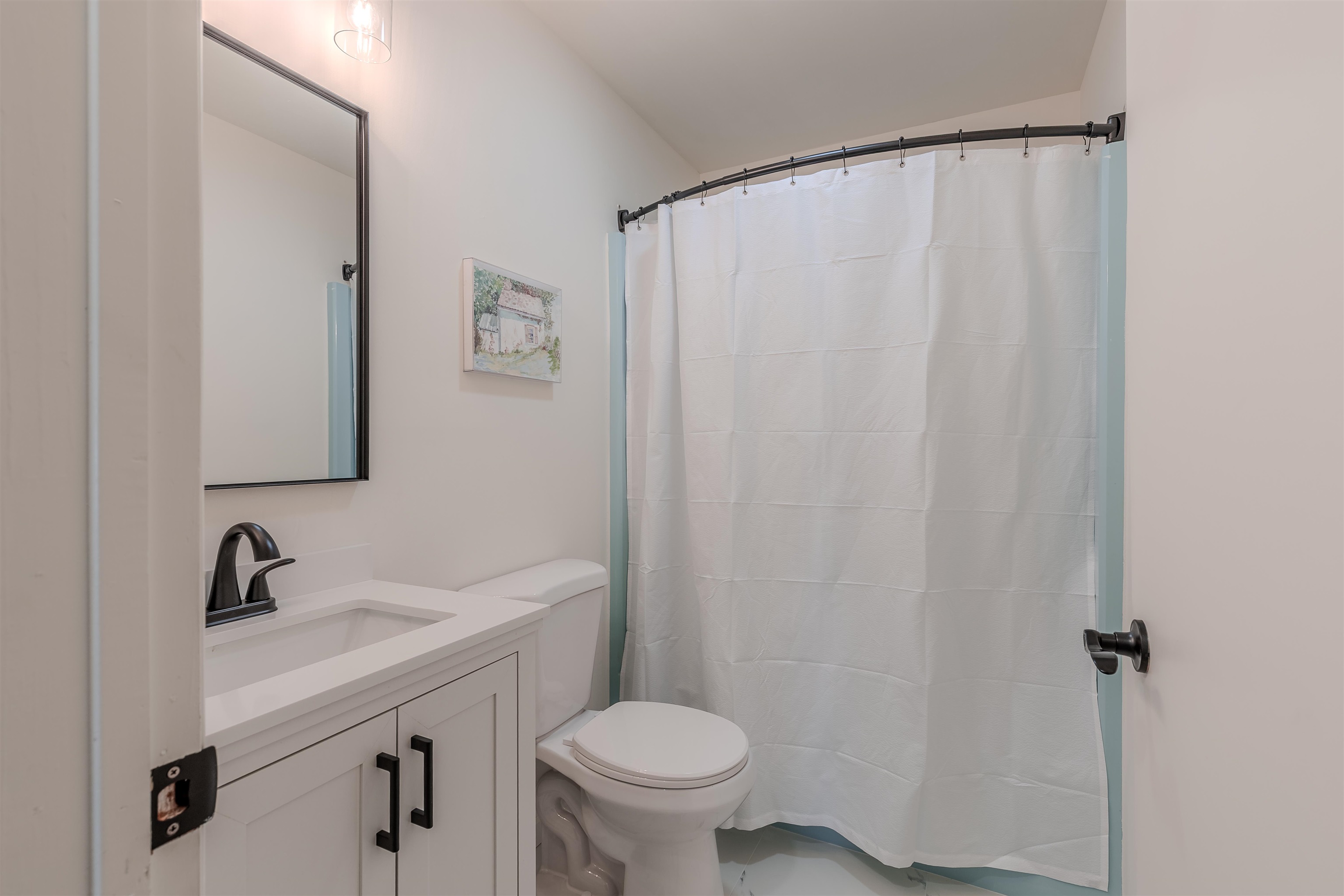 206 Holly Drive Rio Grande, NJ 08242 - Photo 16 of 30 a bathroom with a sink a toilet and a mirror