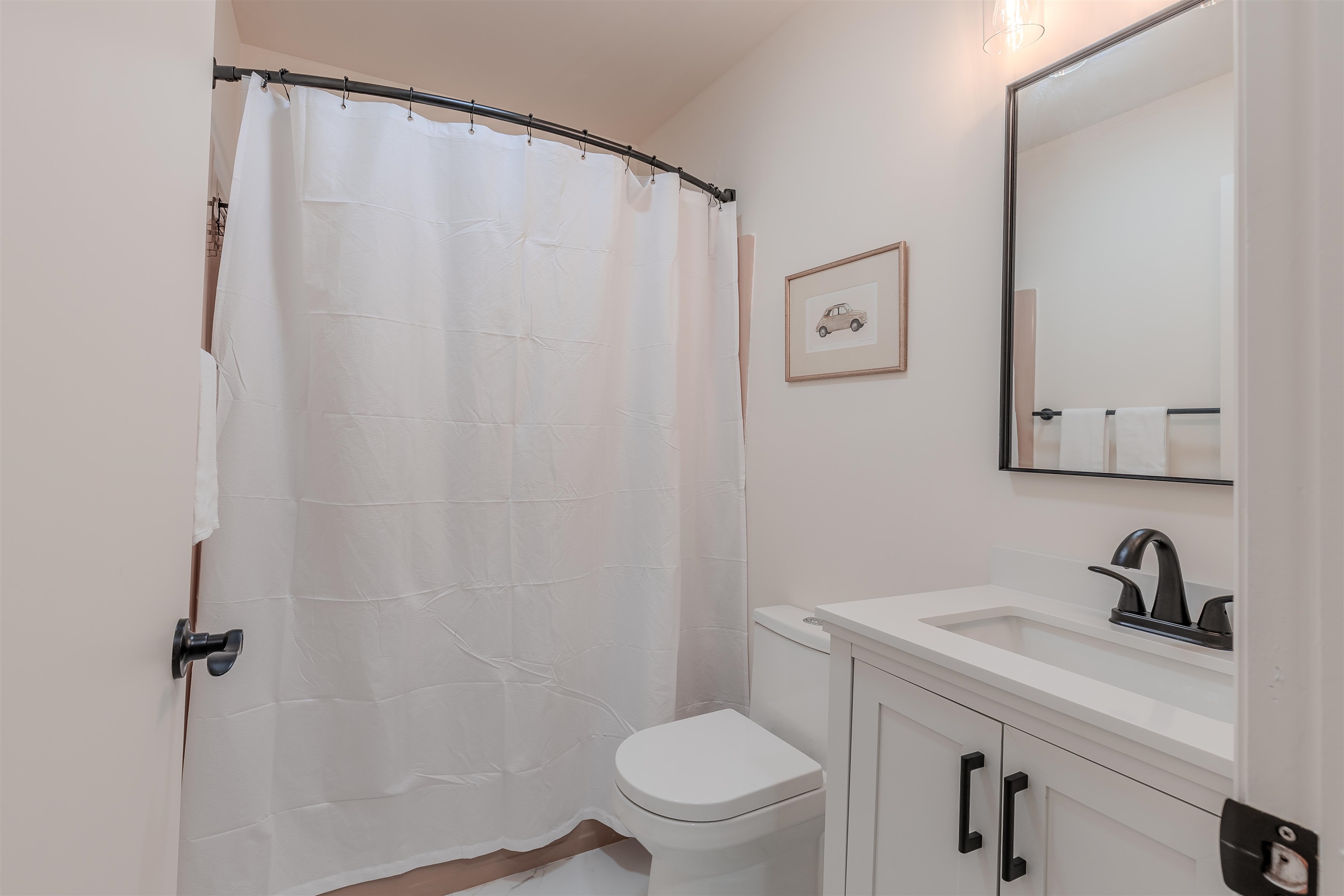 206 Holly Drive Rio Grande, NJ 08242 - Photo 22 of 30 a bathroom with a sink a toilet and a mirror