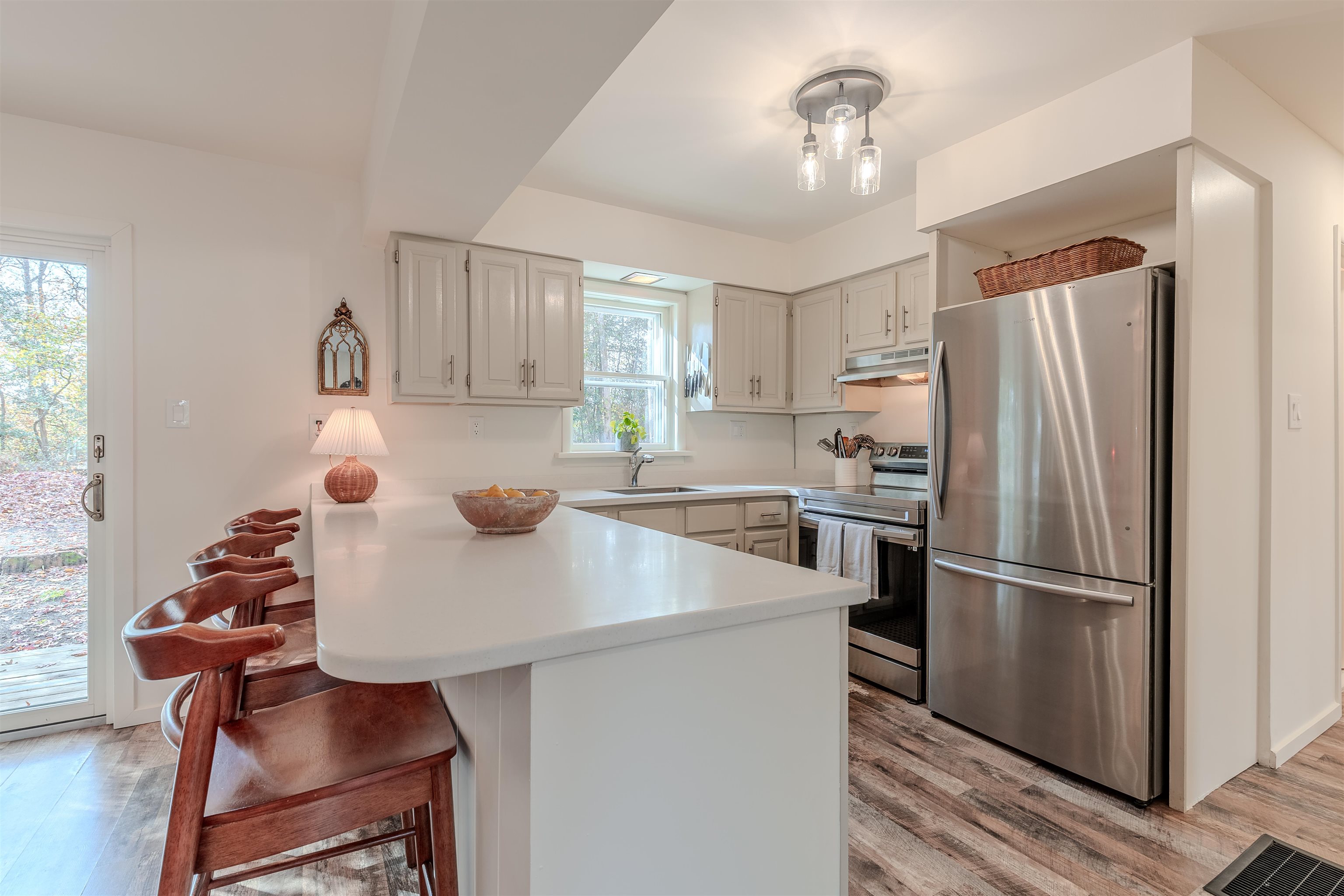 206 Holly Drive Rio Grande, NJ 08242 - Photo 10 of 30 a kitchen with refrigerator and chairs