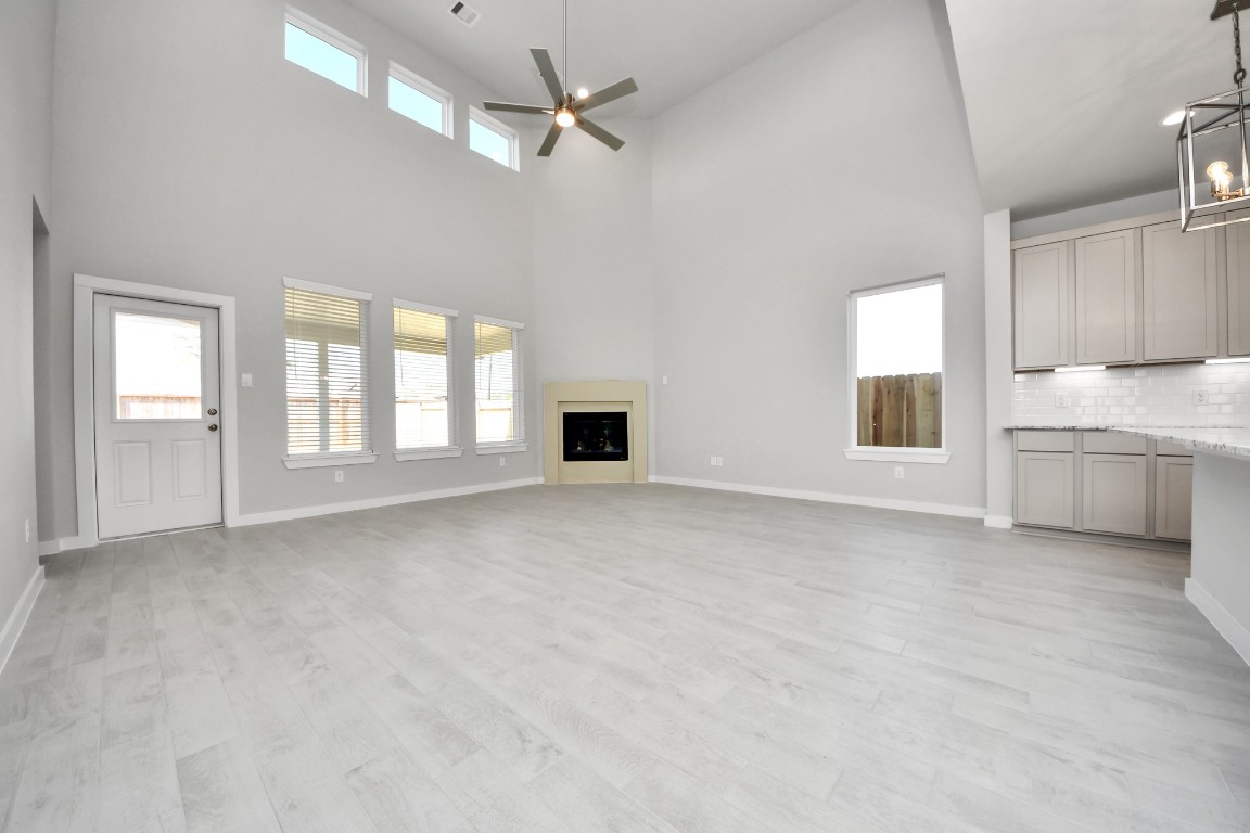 15802 Telge Ridge Lane Cypress, TX 77429 - Photo 28 of 45 a view of an empty room with a window and a kitchen