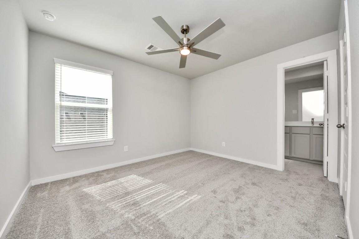 15802 Telge Ridge Lane Cypress, TX 77429 - Photo 43 of 45 a view of a livingroom with a ceiling fan and window