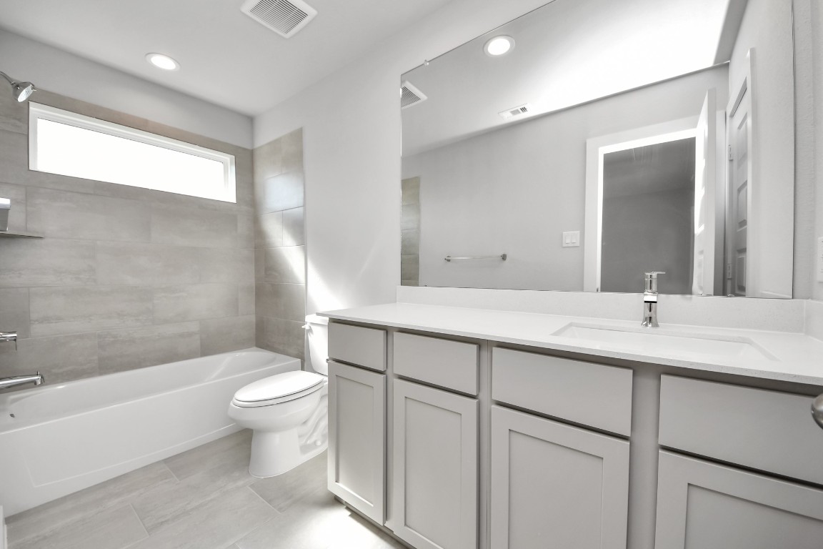 15802 Telge Ridge Lane Cypress, TX 77429 - Photo 44 of 45 a bathroom with a double vanity sink toilet and shower