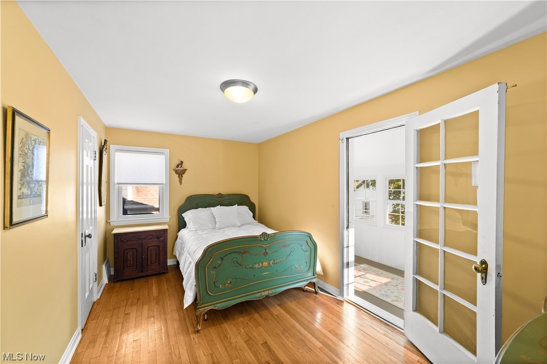 15722 Munn Road Cleveland, OH 44111 - Photo 15 of 32 Bedroom featuring light hardwood flooring