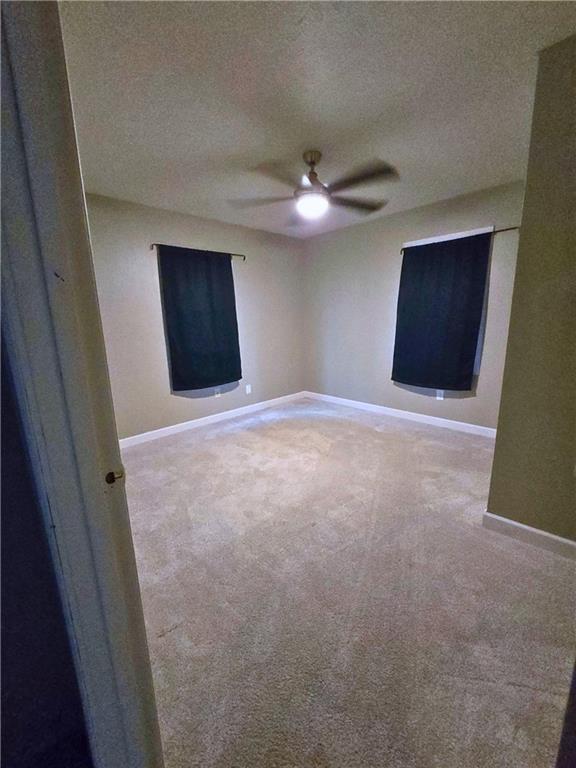 705 South State Line Road Sharon, PA 16146 - Photo 12 of 12 en empty room with a ceiling fan and a window