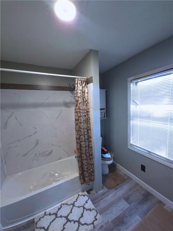 705 South State Line Road Sharon, PA 16146 - Photo 9 of 12 a bathroom with a bathtub and a shower