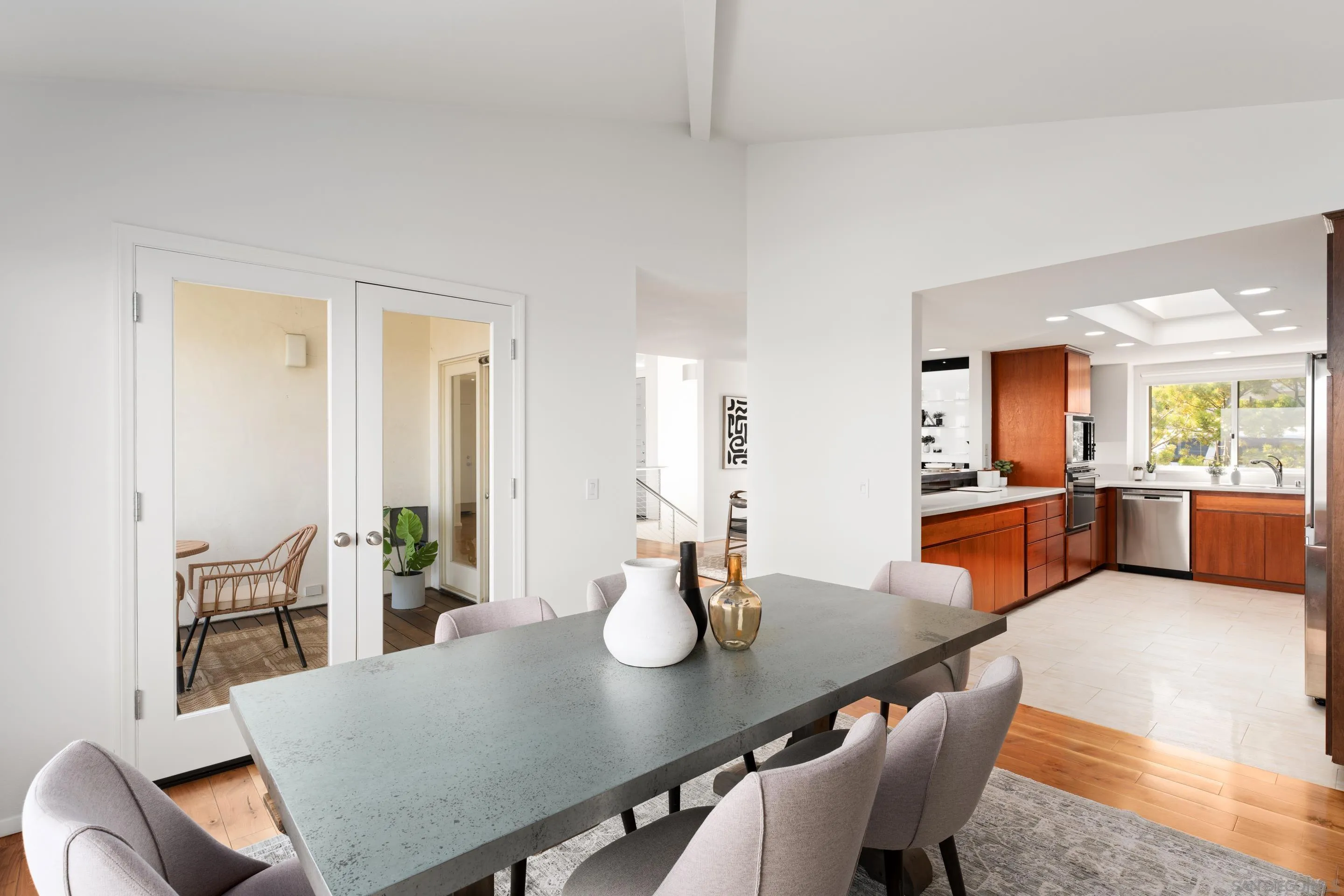 5665 Soledad Mountain Road La Jolla, CA 92037 - Photo 16 of 52 a view of a dining room and chairs in a room