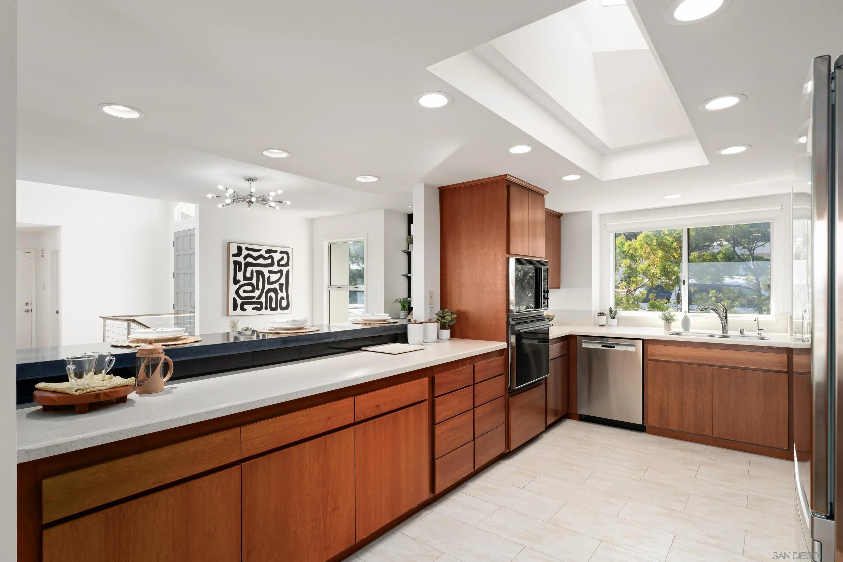 5665 Soledad Mountain Road La Jolla, CA 92037 - Photo 17 of 52 a kitchen with lots of counter space and a sink