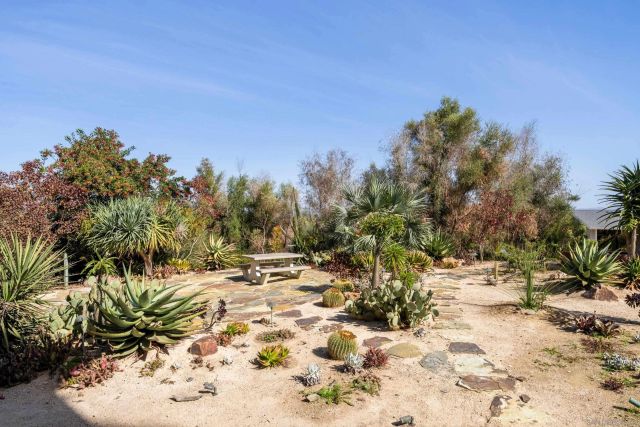 a view of outdoor space with a house in the background