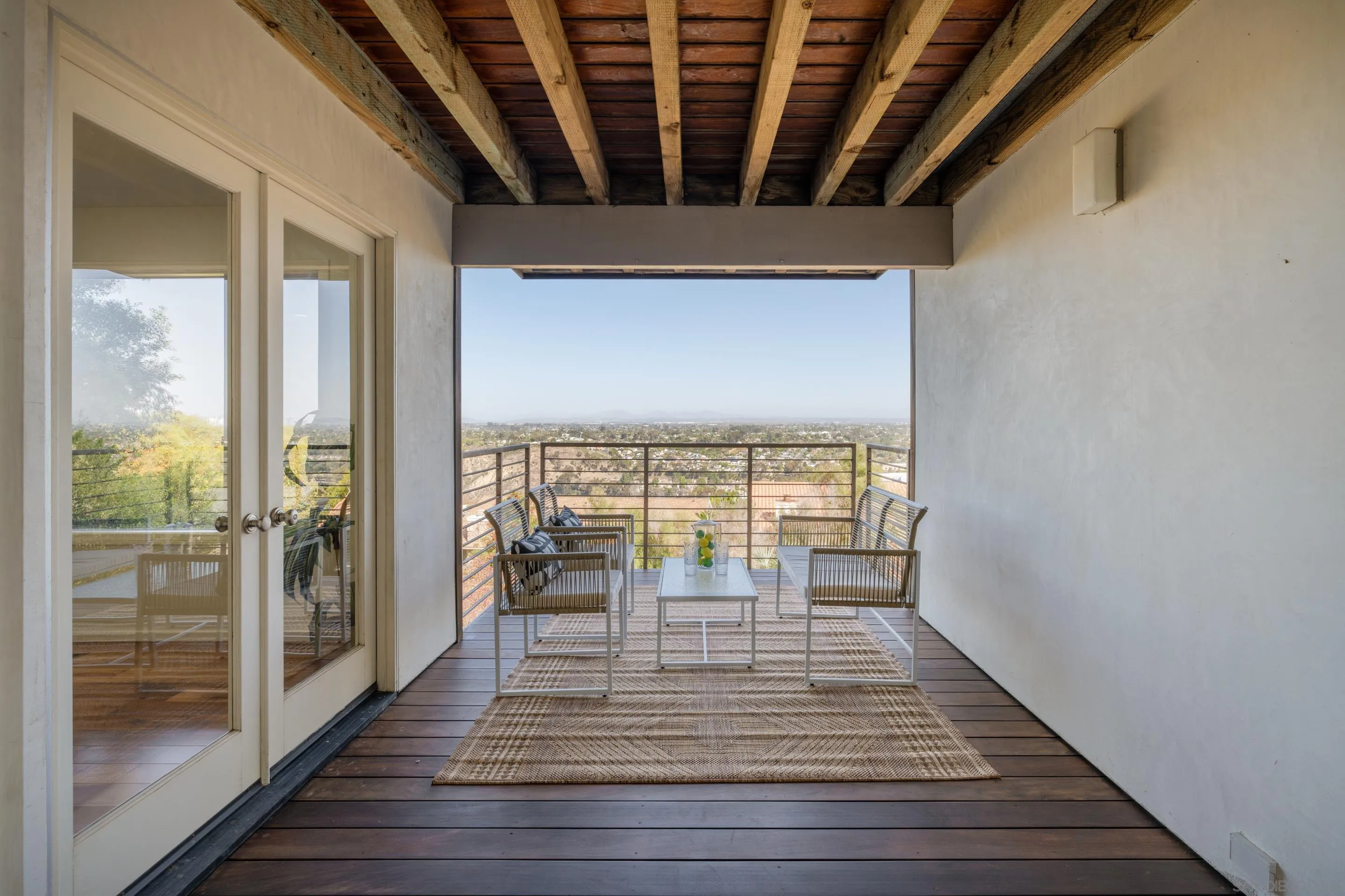 5665 Soledad Mountain Road La Jolla, CA 92037 - Photo 44 of 52 a view of hallway with wooden floor and floor to ceiling window
