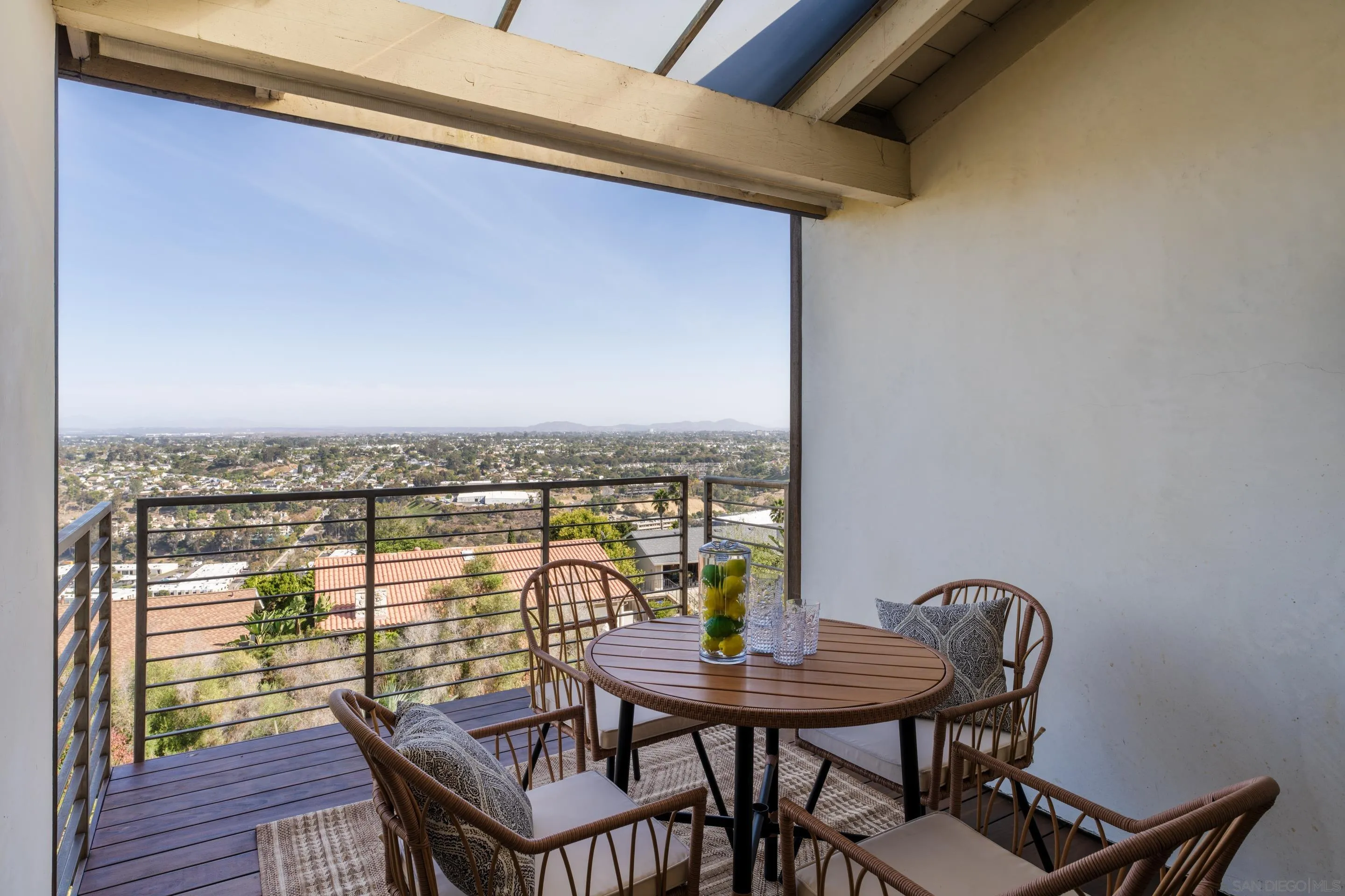 5665 Soledad Mountain Road La Jolla, CA 92037 - Photo 49 of 52 a view of a balcony with a table and chairs