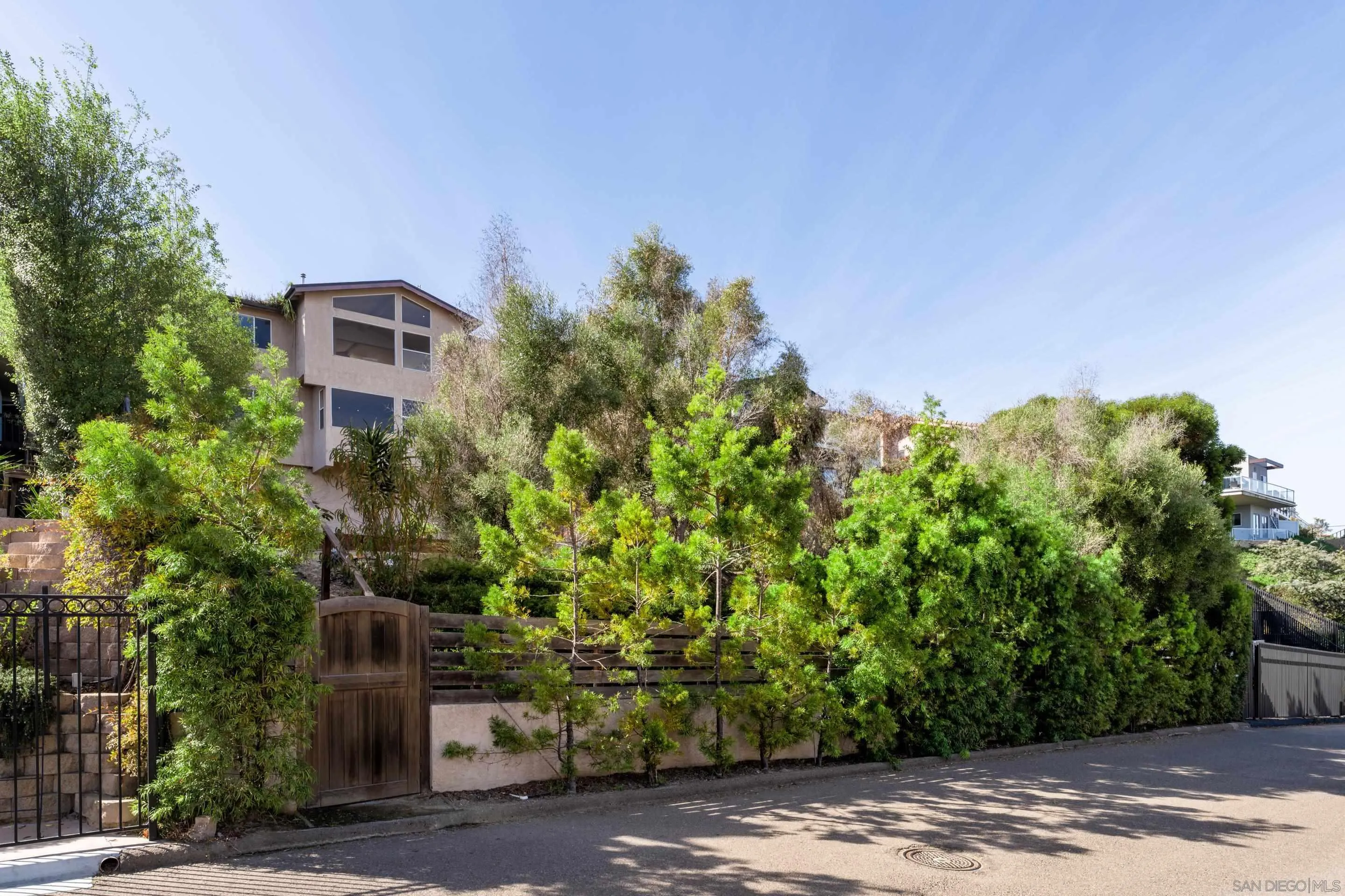 5665 Soledad Mountain Road La Jolla, CA 92037 - Photo 52 of 52 a front view of a house with a yard