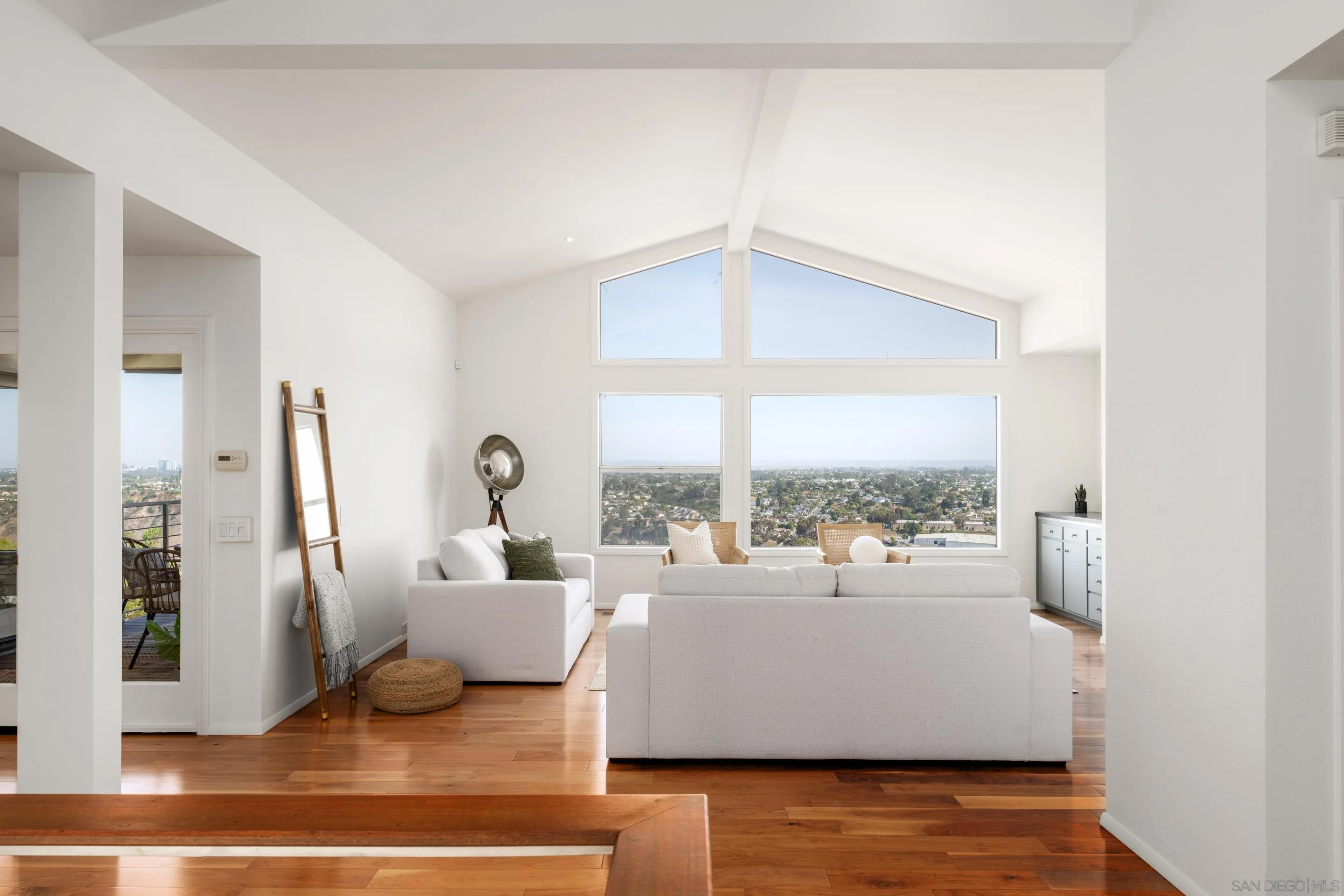 5665 Soledad Mountain Road La Jolla, CA 92037 - Photo 7 of 52 a living room with furniture and a large window