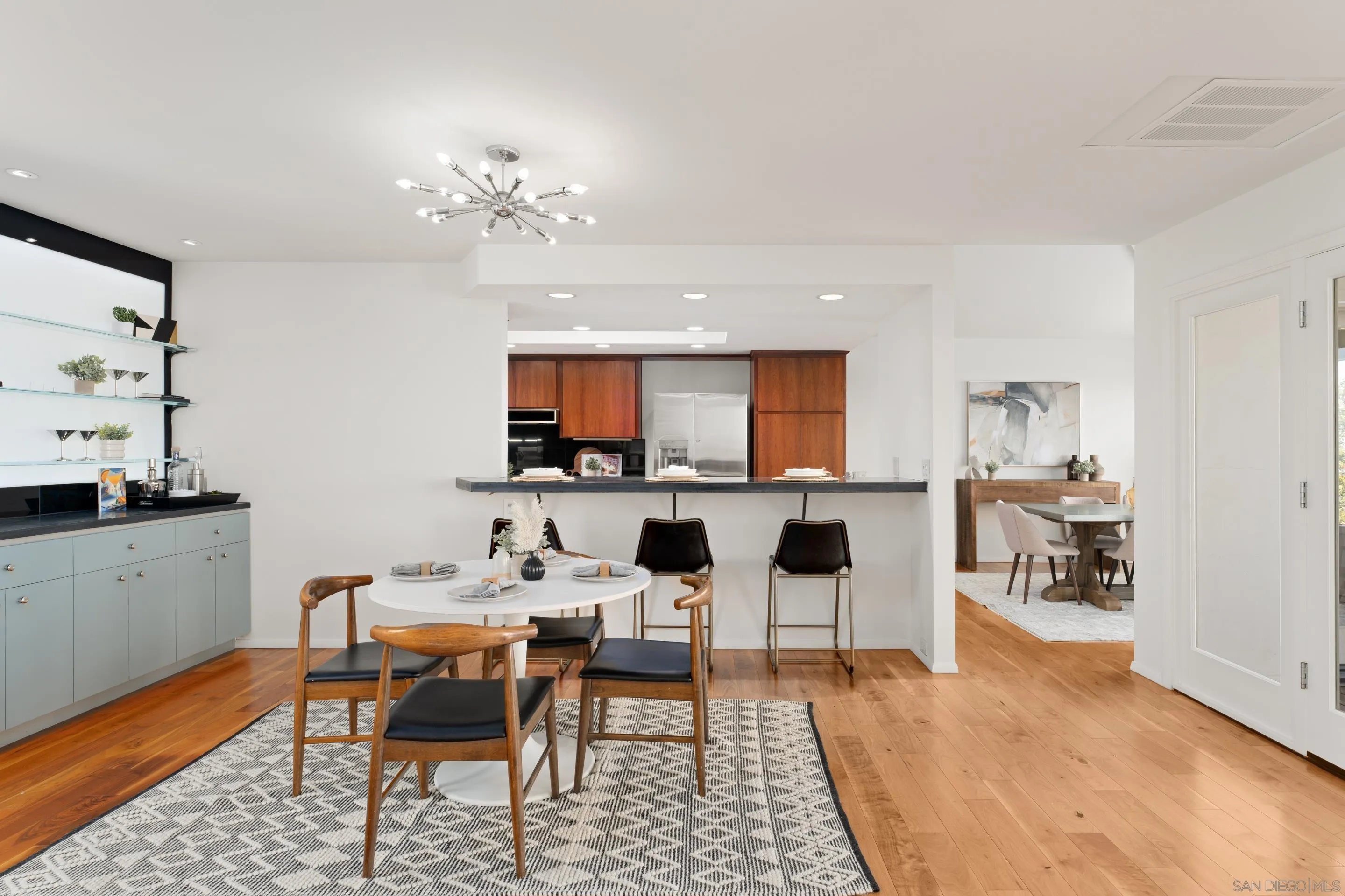 5665 Soledad Mountain Road La Jolla, CA 92037 - Photo 8 of 52 a living room with fireplace furniture and a wooden floor