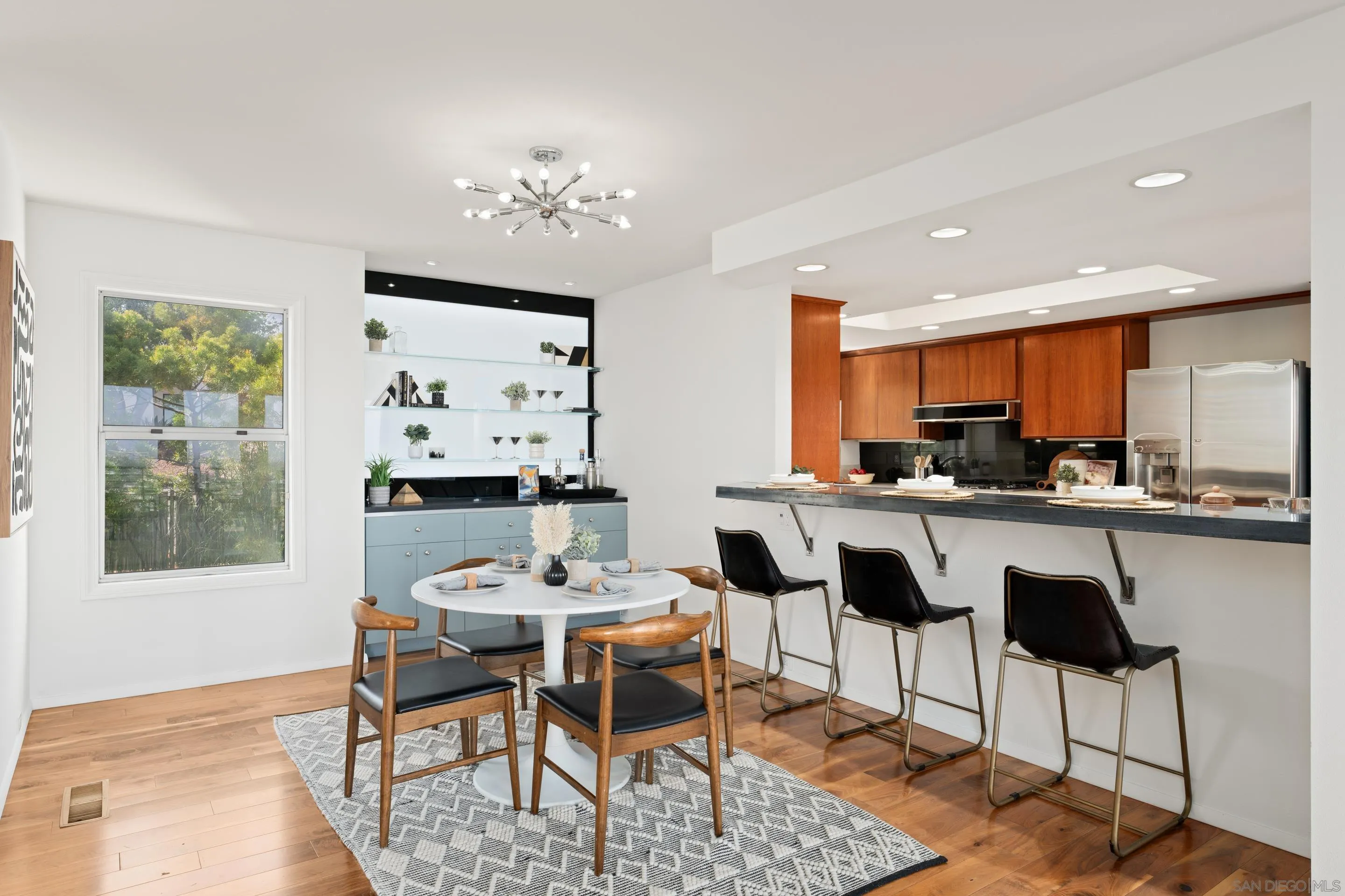5665 Soledad Mountain Road La Jolla, CA 92037 - Photo 9 of 52 a dining room with furniture a window and kitchen view