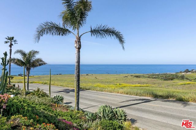 a view of an ocean and a yard