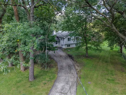 a view of a pathway with a yard