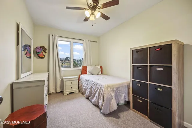 a bed room with a bed and a window