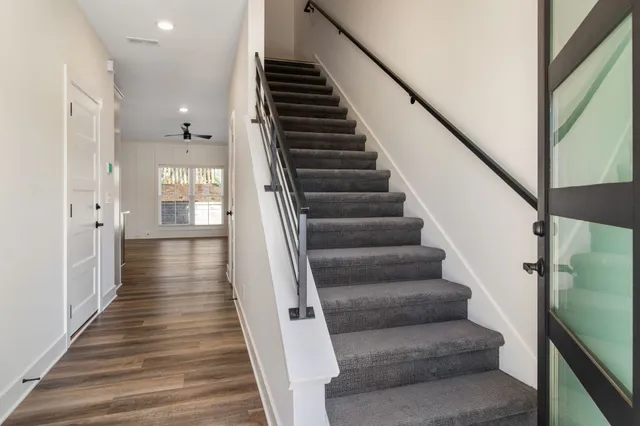 a view of entryway and hall with wooden floor