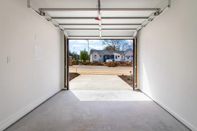 a view of a hallway with a glass door and a porch
