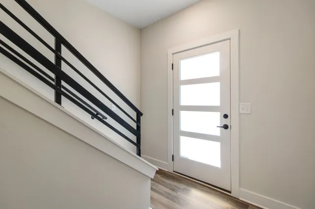 a view of an empty room and wooden floor