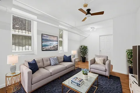 a living room with furniture and a window