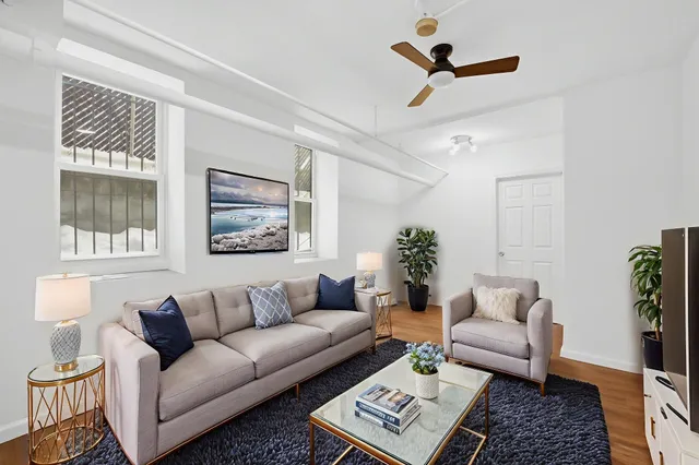 a living room with furniture and a window