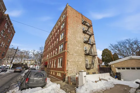 a view of a car park in front of a building