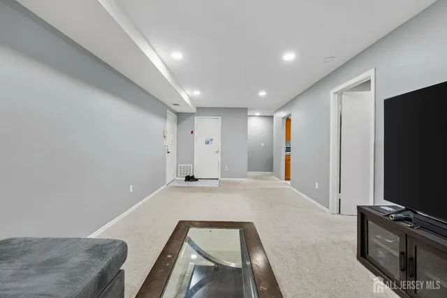 a view of a livingroom with a flat screen tv