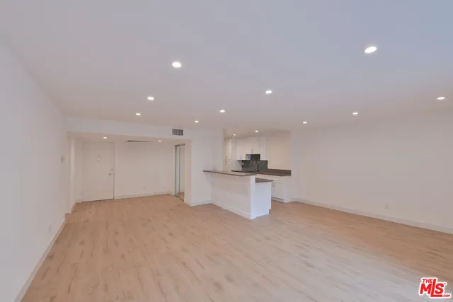 a view of a kitchen and a microwave