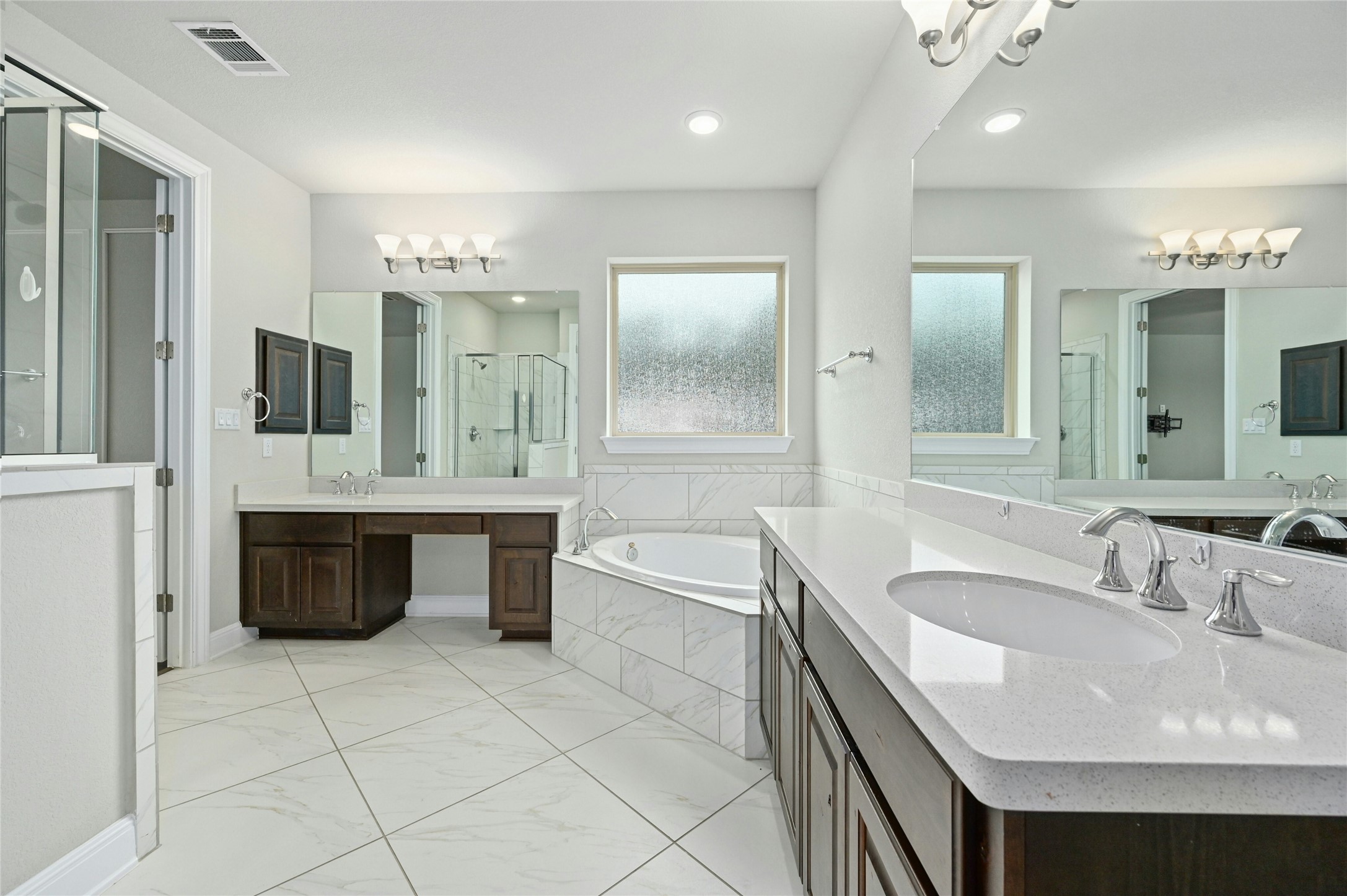4124 Florentine Road Leander, TX 78641 - Photo 22 of 37 Bathroom with vanity and separate shower and tub