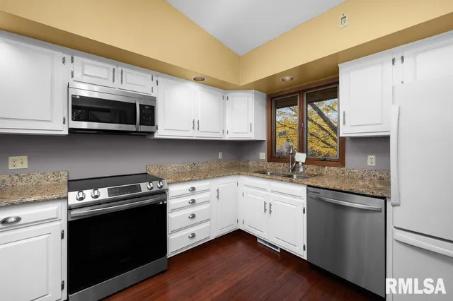 a view of an empty room with glass door