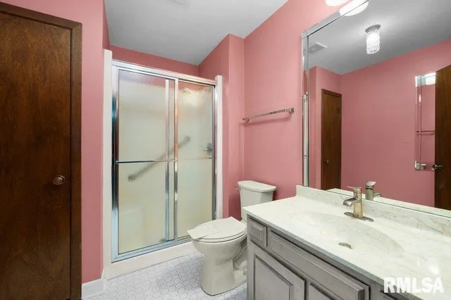 a view of an empty room with a fireplace