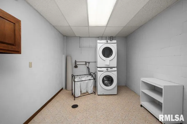 a room with pool table and windows