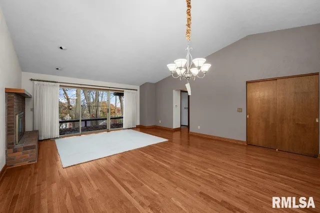 a kitchen with granite countertop cabinets stainless steel appliances a sink and wooden floor