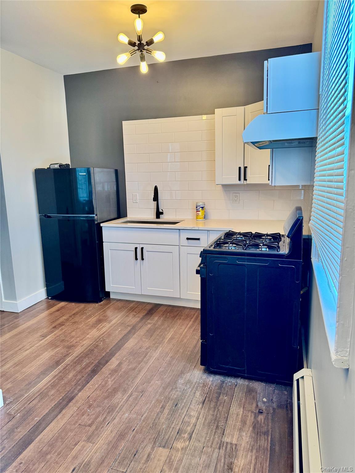 110 Titicus Road North Salem, NY 10560 - Photo 3 of 12 a kitchen with stainless steel appliances granite countertop a sink a stove a refrigerator cabinets and wooden floor