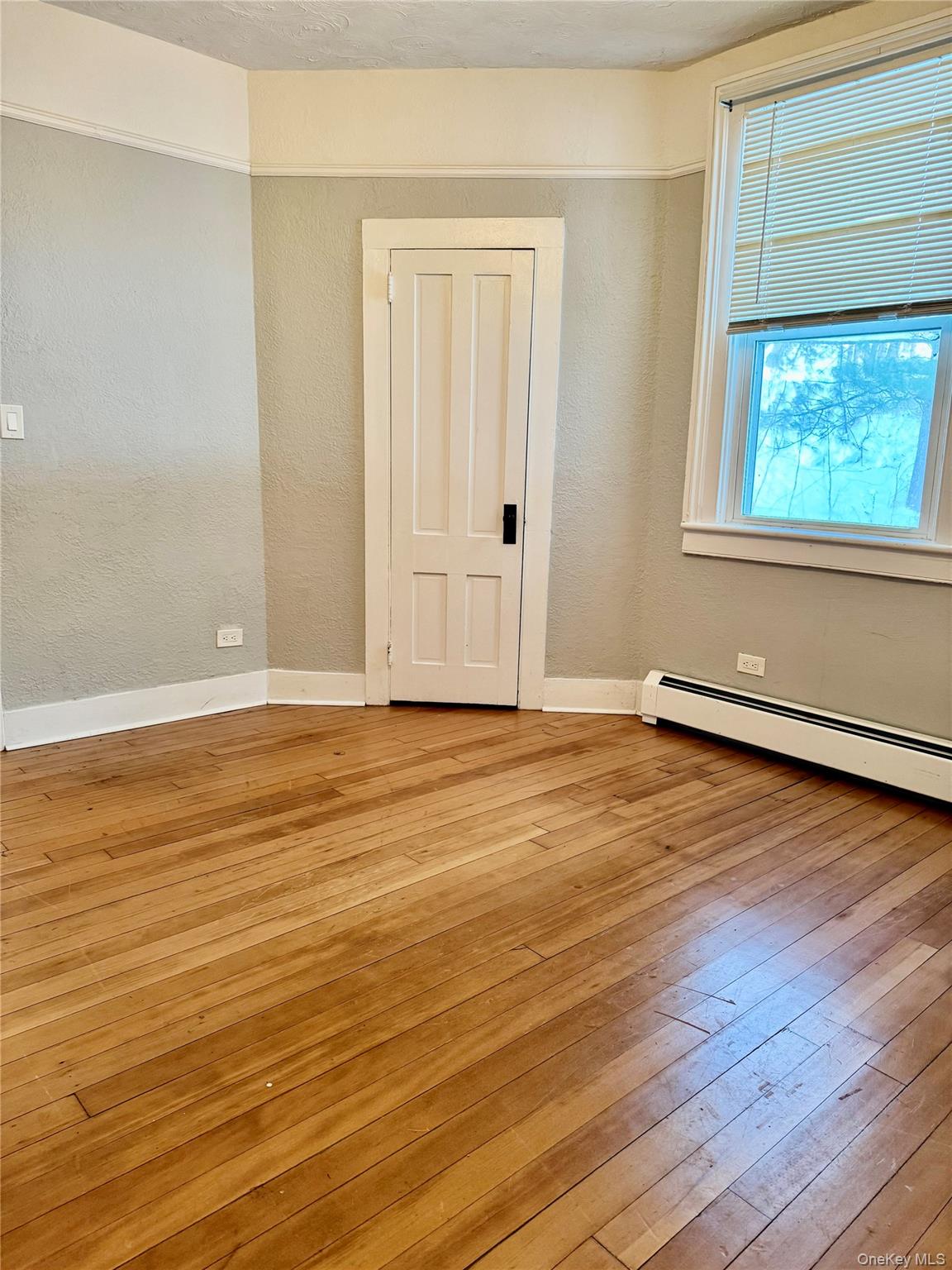 110 Titicus Road North Salem, NY 10560 - Photo 7 of 12 a view of an empty room with wooden floor and a window