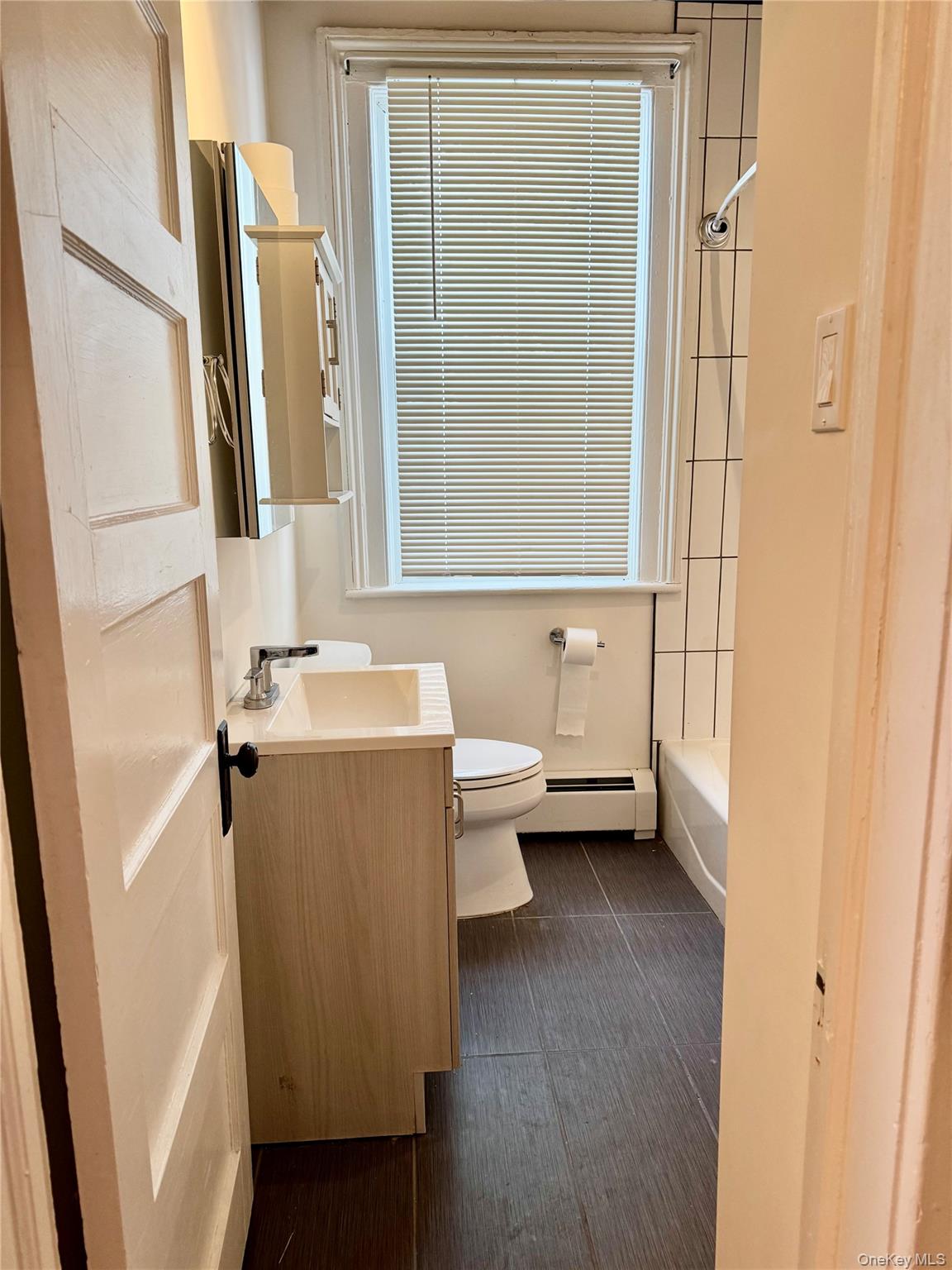 110 Titicus Road North Salem, NY 10560 - Photo 10 of 12 a bathroom with a sink a mirror and a toilet