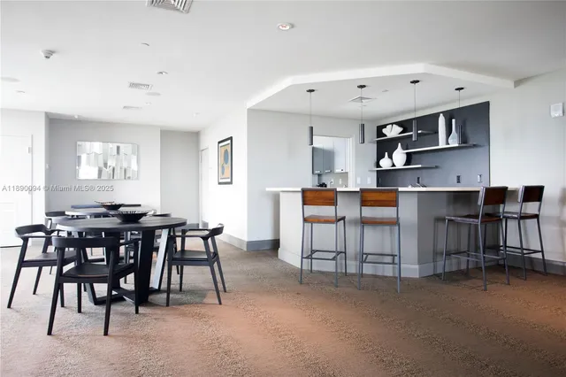 a view of a dining room with furniture